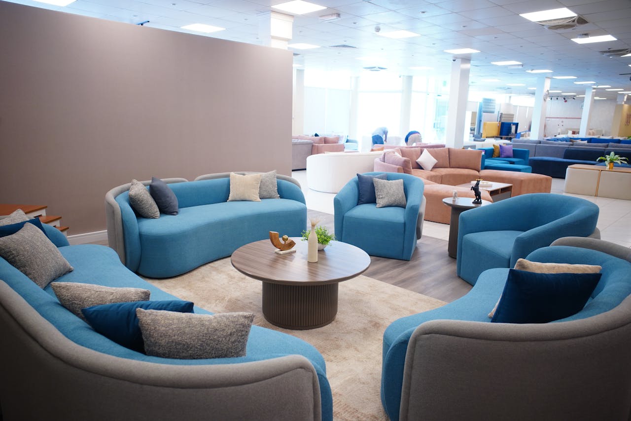 Elegant living room setup featuring blue and beige sofas in a modern style. Perfect for interior design inspiration.